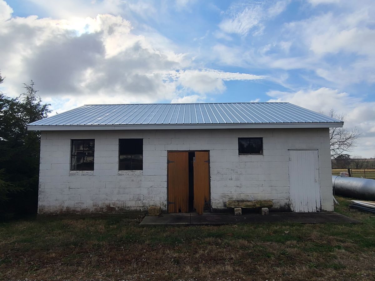 New metal roof installed on cinder block building